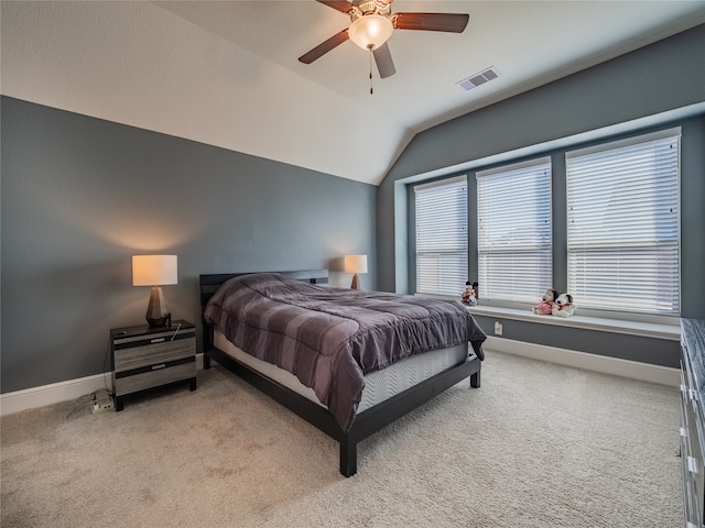 carpeted bedroom featuring vaulted ceiling and ceiling fan