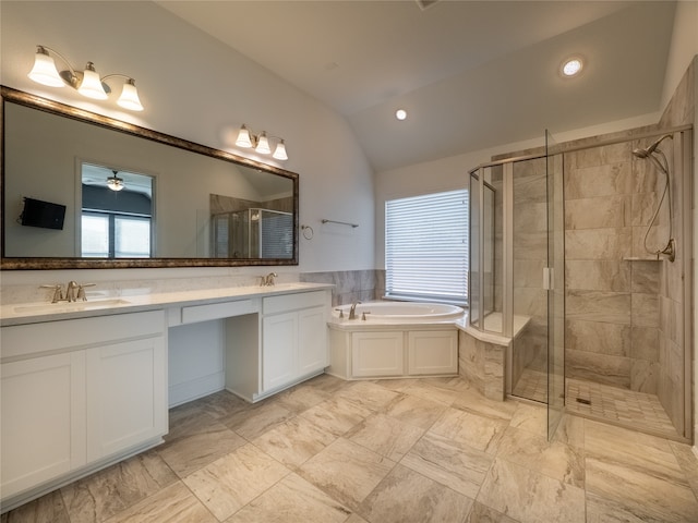 bathroom with shower with separate bathtub, lofted ceiling, and plenty of natural light