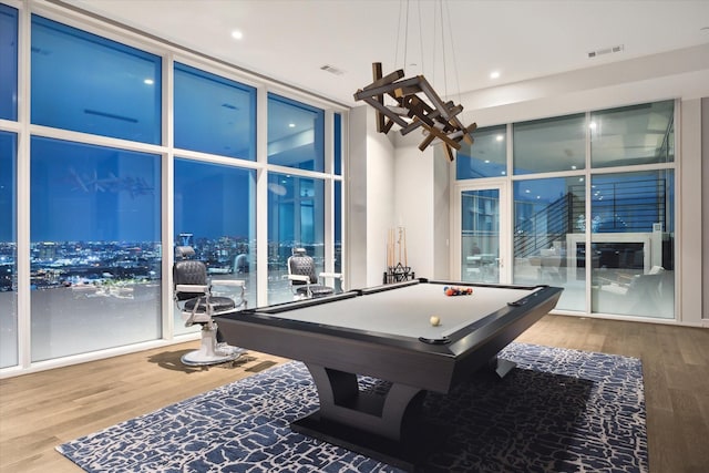 rec room with expansive windows, wood-type flooring, and billiards