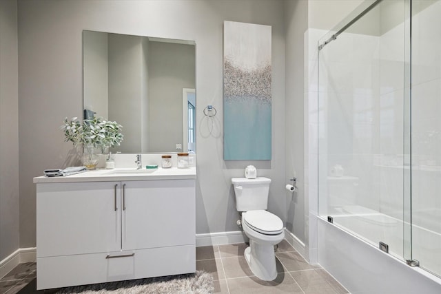 full bathroom with shower / bath combination with glass door, vanity, tile patterned flooring, and toilet