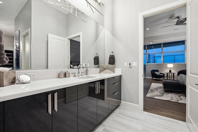 bathroom featuring hardwood / wood-style floors, vanity, and ceiling fan