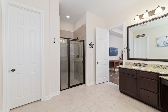 bathroom with vanity, tile patterned flooring, and a shower with shower door