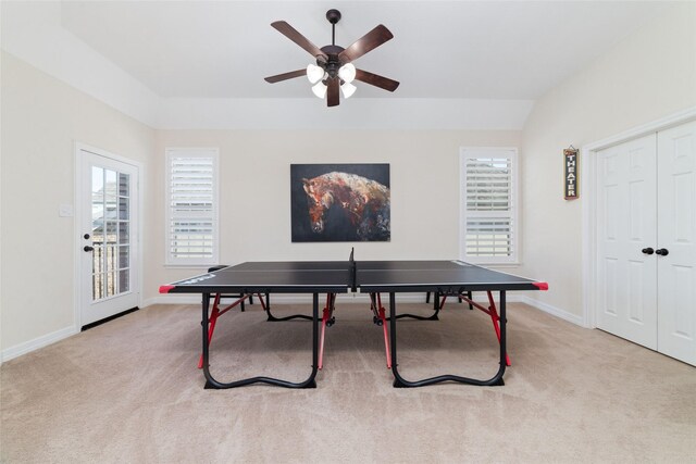 rec room with ceiling fan, light colored carpet, and lofted ceiling