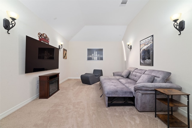 living room featuring lofted ceiling and light carpet