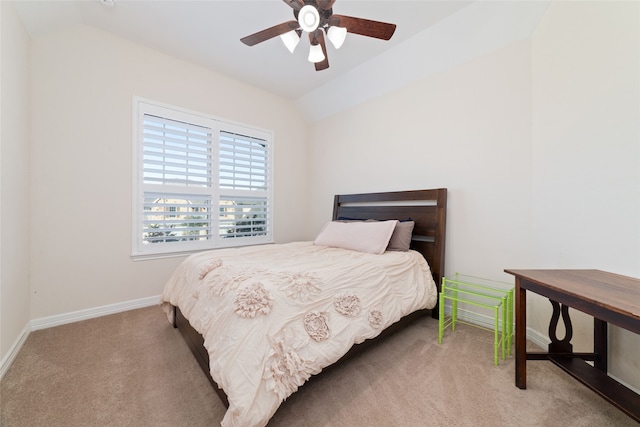 bedroom featuring vaulted ceiling, ceiling fan, and carpet flooring