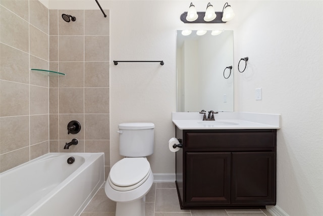 full bathroom with toilet, tiled shower / bath, tile patterned floors, and vanity