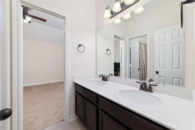 bathroom featuring ceiling fan, tile patterned floors, and vanity