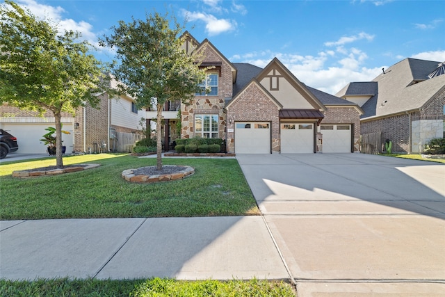 view of front of property featuring a front lawn and a garage