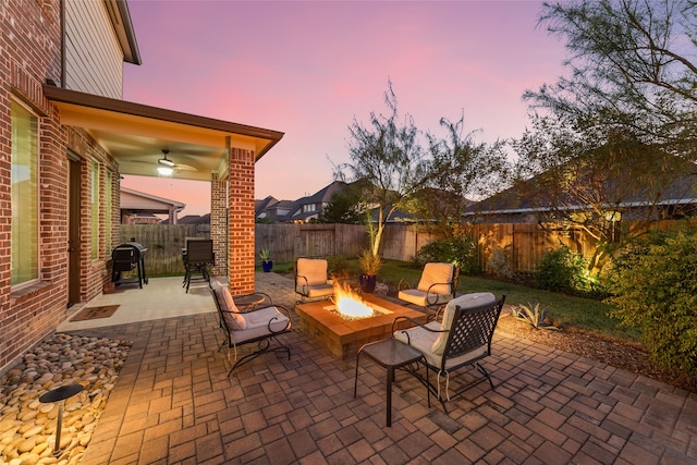 patio terrace at dusk with an outdoor fire pit