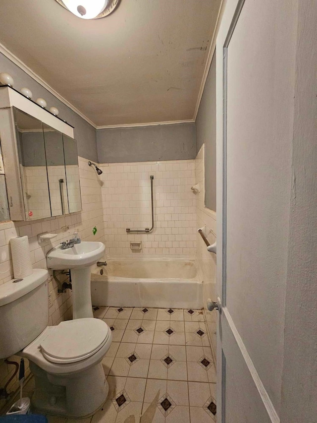 full bathroom with toilet, tile patterned flooring, ornamental molding, and tiled shower / bath