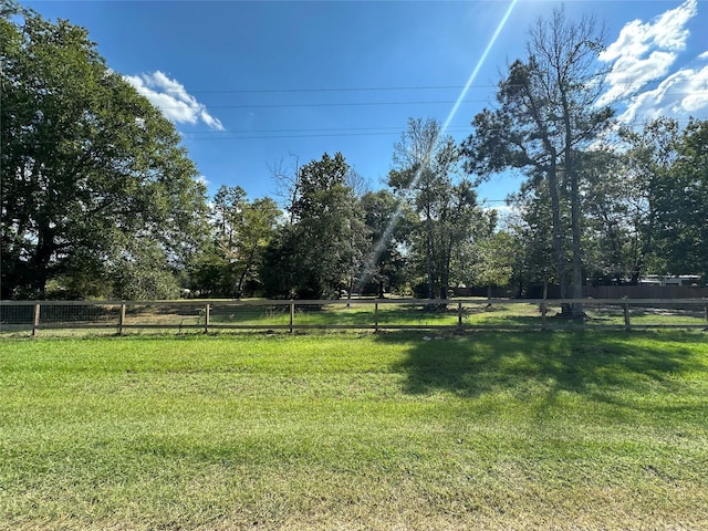 view of yard with a rural view