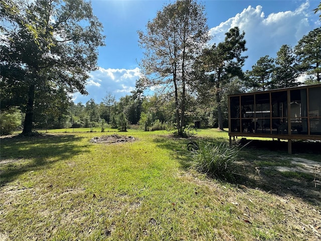 view of yard with a sunroom