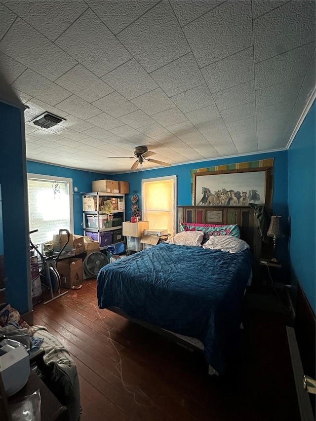 bedroom with ceiling fan and wood-type flooring