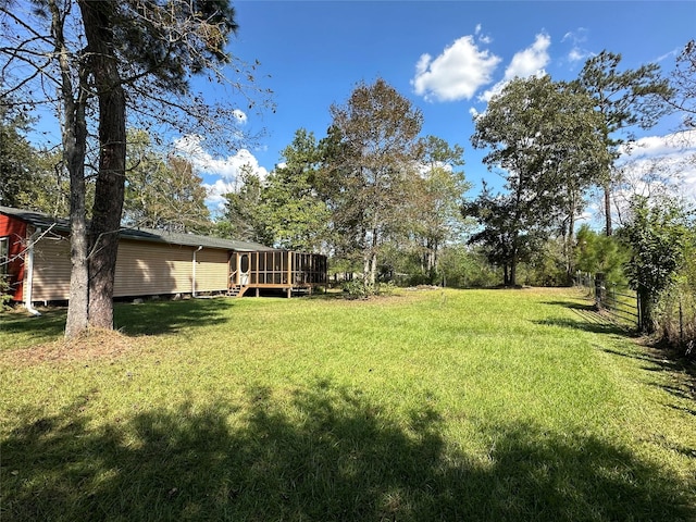 view of yard with a wooden deck