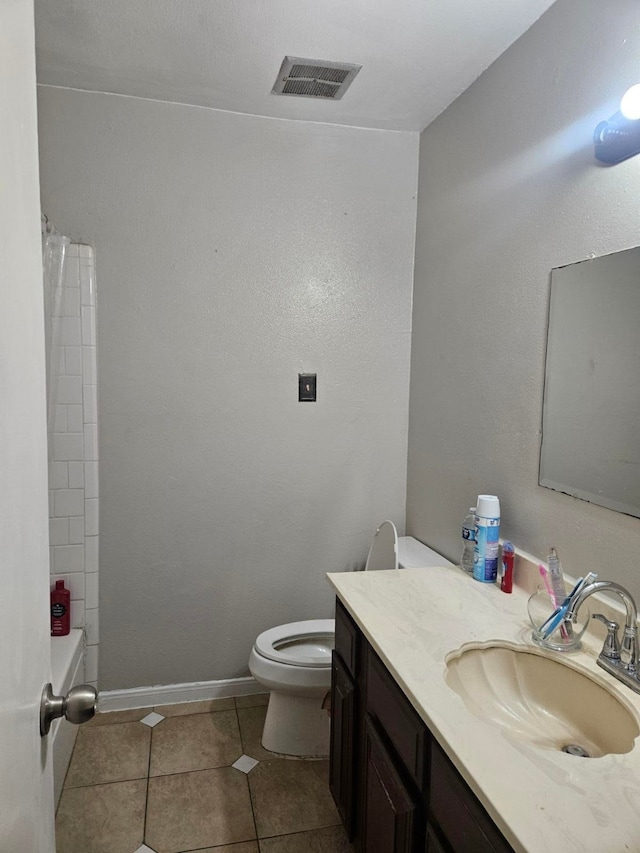 full bathroom featuring shower / bath combo with shower curtain, tile patterned flooring, vanity, and toilet