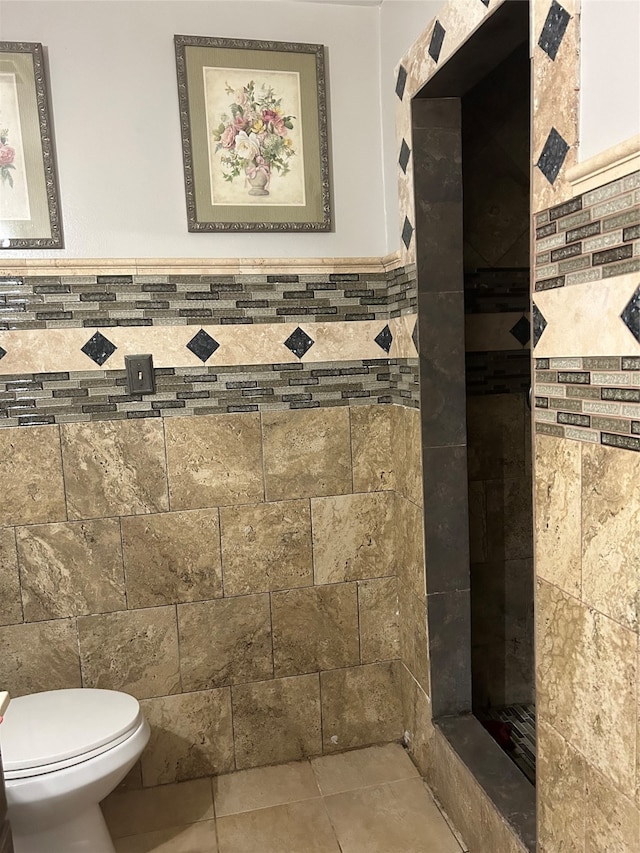 bathroom with tile patterned flooring and toilet