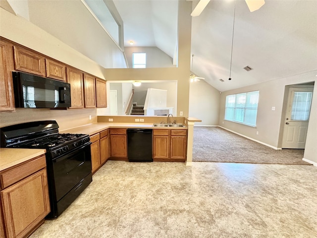 kitchen featuring kitchen peninsula, black appliances, ceiling fan, sink, and light colored carpet