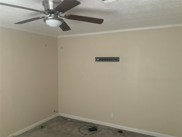 carpeted empty room with ornamental molding, ceiling fan, and a textured ceiling