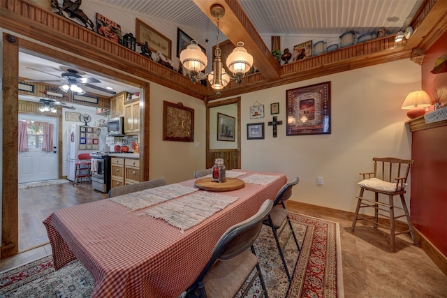 dining space with ceiling fan with notable chandelier and lofted ceiling