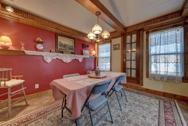 tiled dining area featuring a chandelier and beam ceiling