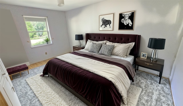 bedroom with light hardwood / wood-style floors