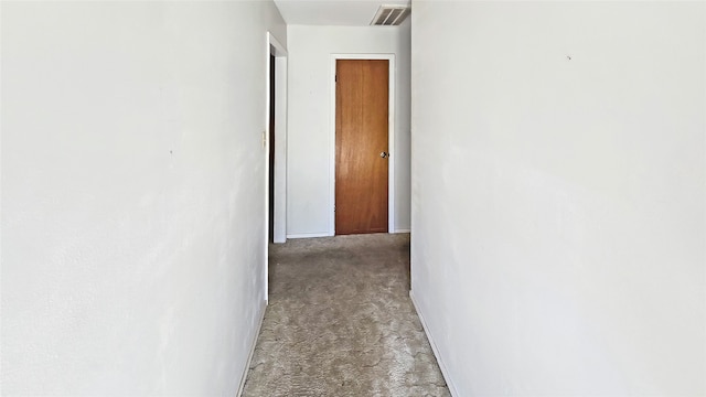 hallway with light carpet