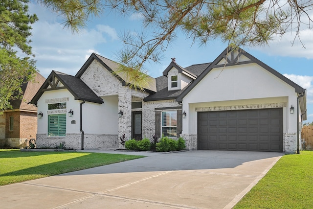 view of front facade with a front yard and a garage