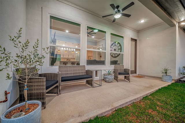 view of patio featuring ceiling fan