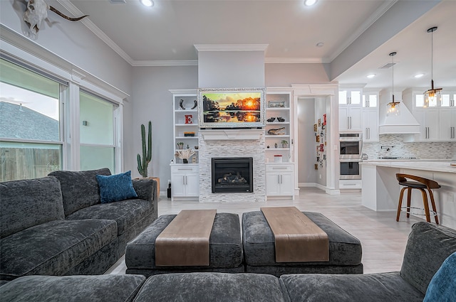 living room with crown molding and light hardwood / wood-style flooring