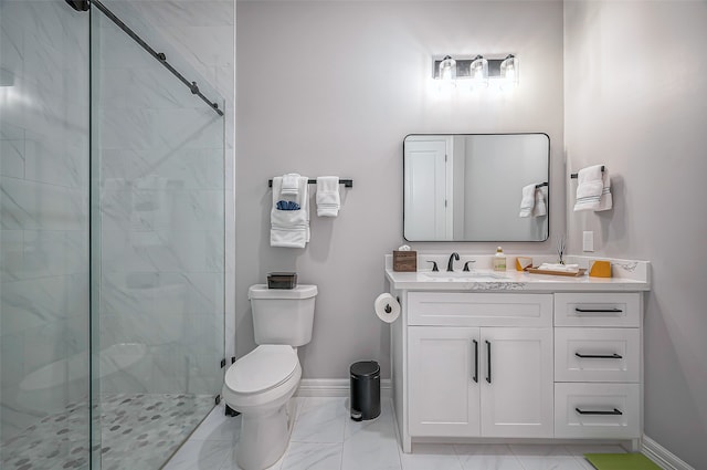 bathroom with toilet, vanity, and an enclosed shower