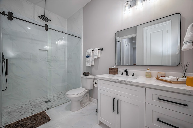 bathroom with toilet, a shower with door, and vanity