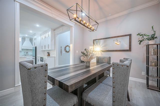 dining space featuring crown molding and wood-type flooring