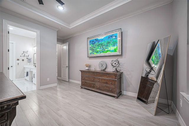 interior space featuring light wood-type flooring and crown molding