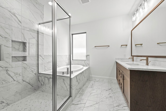 bathroom with vanity and separate shower and tub