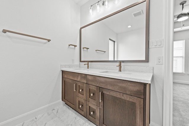 bathroom featuring vanity and ceiling fan