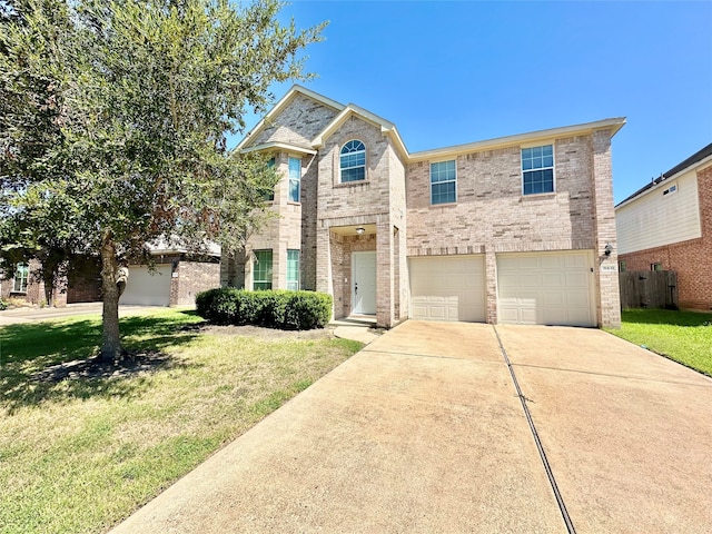 view of front of property featuring a garage and a front lawn