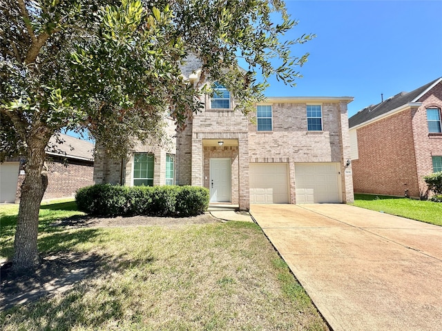 view of front of property with a front yard and a garage