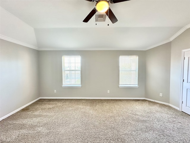 unfurnished room featuring carpet, ceiling fan, vaulted ceiling, and crown molding