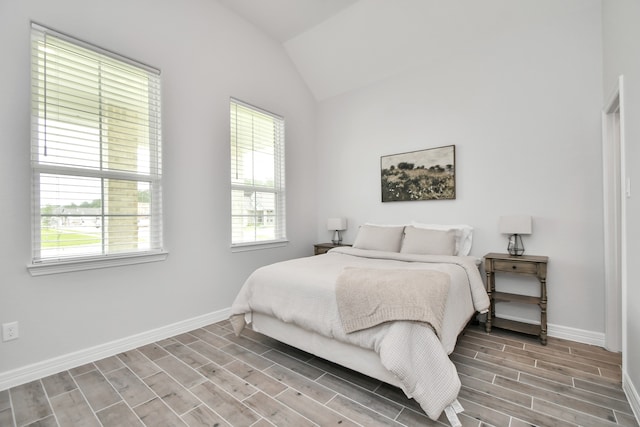 bedroom featuring wood-type flooring and lofted ceiling