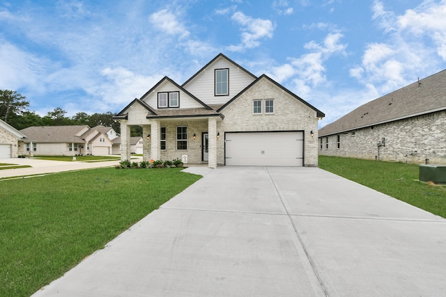 view of front of home featuring a front yard, a garage, and central AC unit