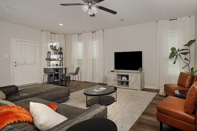 living room with ceiling fan and hardwood / wood-style floors