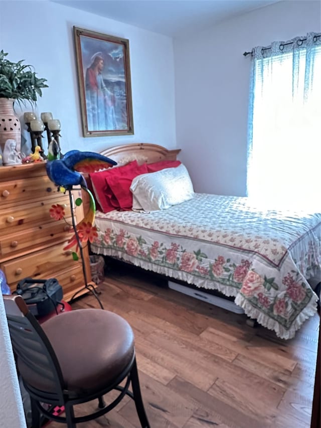 bedroom featuring hardwood / wood-style floors