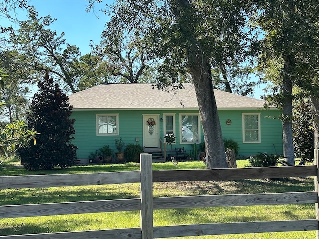 ranch-style house with a front yard