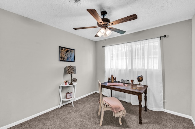 office with a textured ceiling, carpet, and ceiling fan