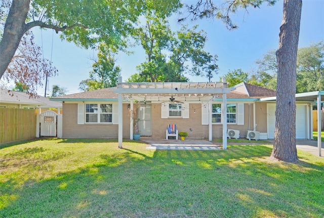 back of house with a patio, a garage, a lawn, and a pergola