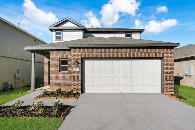 view of front of property with cooling unit and a garage