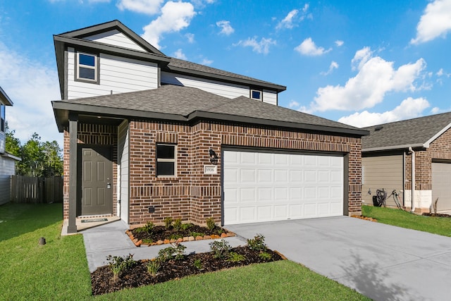 view of front property featuring a garage and a front yard