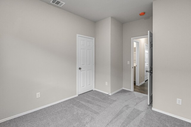 unfurnished bedroom with light carpet