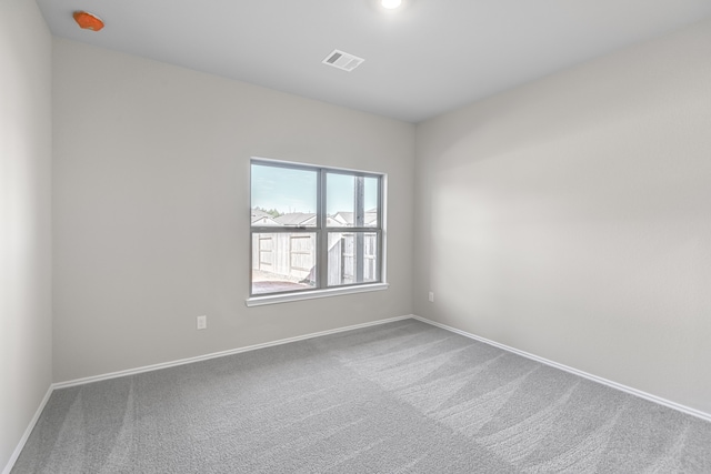 unfurnished room with carpet flooring