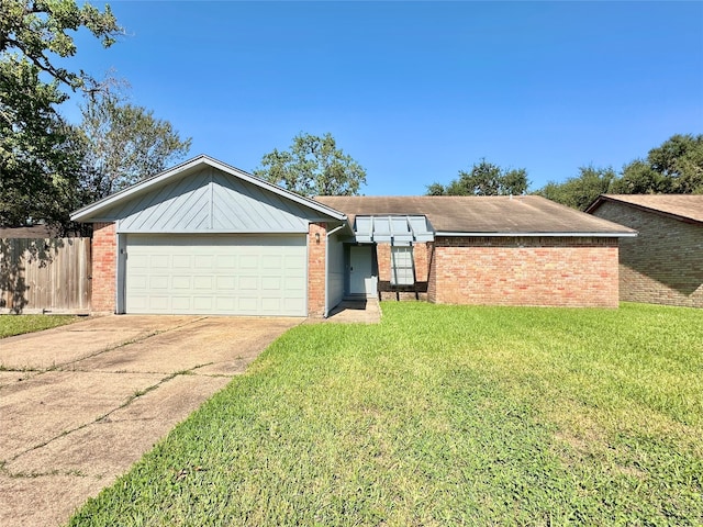 single story home featuring a garage and a front yard